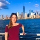 Margaret "Maggie" Strode in front of Manhattan skyline